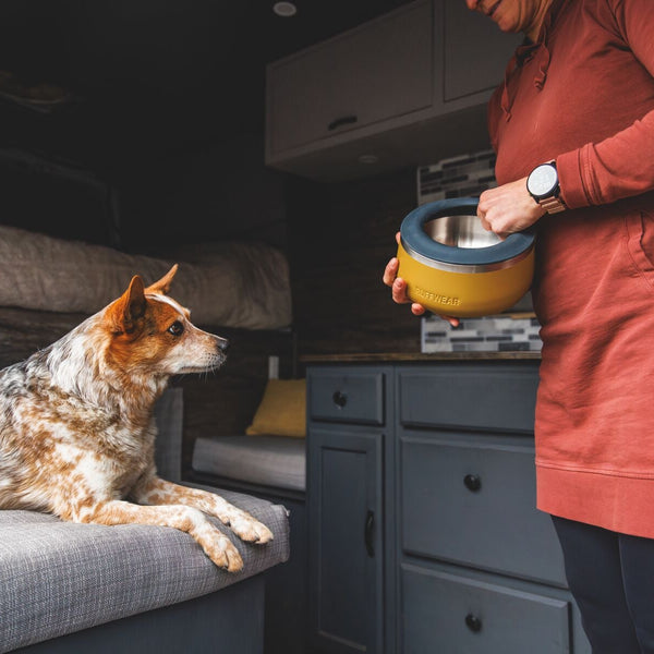 A woman adds an anti-splash ring to her Basecamp bowl