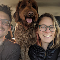 Graham and Shannon take a selfie with dog Pebble in the car.