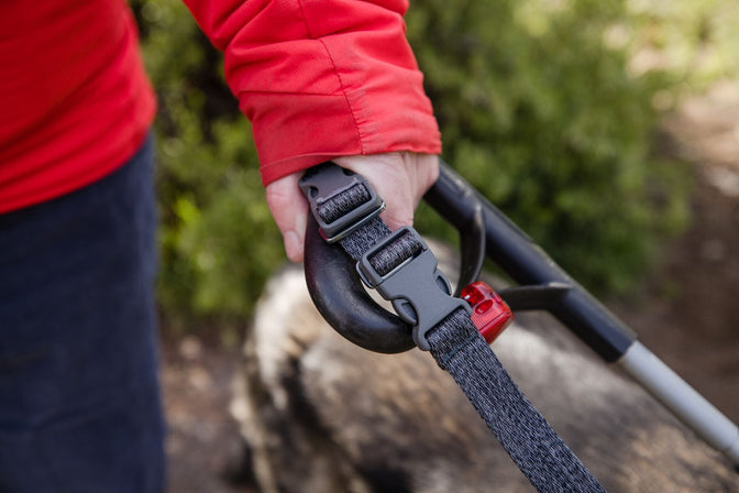 Woman holds padded handle of guide dog leash.